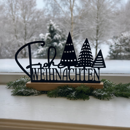 Aufsteller "Frohe Weihnachten" mit Tannenbäumen