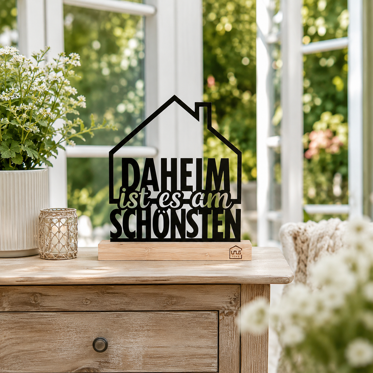 Aufsteller mit Text "Daheim ist es am schönsten"